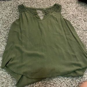 Green linen tank top with geometric lace detail.